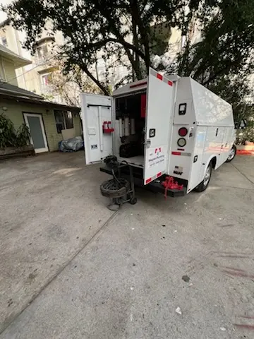 Magnet Plumbing service vehicle on-site for Grease Trap Cleaning in Palisades Estates
